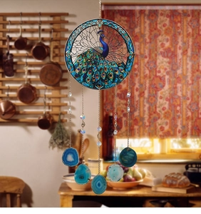 Detailed view of peacock suncatcher with blue agate slices and hanging crystal beads