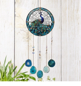 Detail of acrylic peacock suncatcher with hanging natural agate slices and crystals