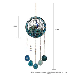 Detail view of peacock suncatcher with dimensions 20cm by 63cm and natural agate slices
