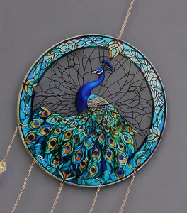 Detail of colorful acrylic peacock suncatcher with intricate stained glass effect
