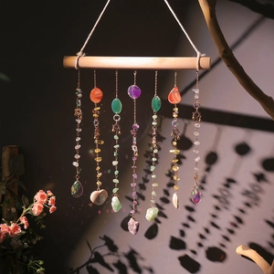 Bohemian crystal suncatcher with natural agate slices and gemstones on a wooden stick