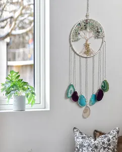 Detail of life tree dream catcher with natural agate slices and crystals home decor