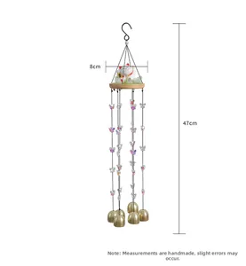 Detailed view of lucky cat wind chime with five bells and colorful butterflies