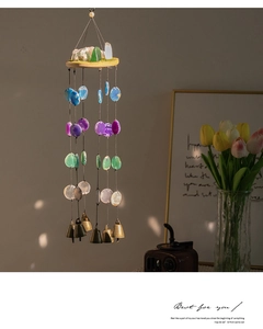 Detailed view of handmade agate slice wind chime with natural crystal and metal bells