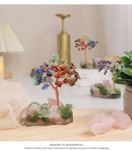 Detail of handcrafted wire-wrapped money tree with multi-color crystals and stone base