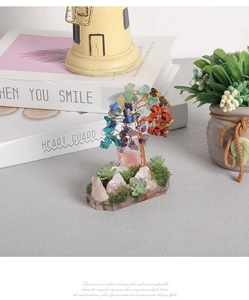 Detailed view of colorful natural gemstone leaves on a handmade wire money tree