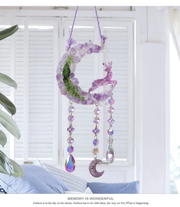 Detail view of purple crystal moon hanging decor with deer and aurora water drop prisms