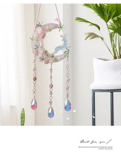 Detail of pink crystal moon hanging with iridescent star charms and AB-coated teardrop pendants