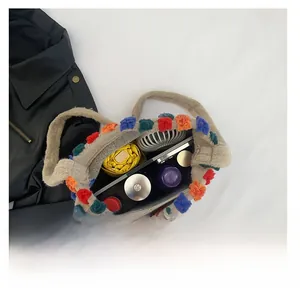 Top view of colorful plush bucket bag interior showing capacity for umbrella and daily items