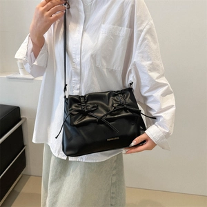 Black PU shoulder bag with vertical pleats and dual bows for a minimalist look