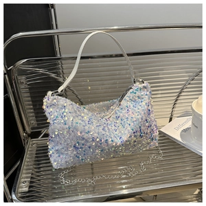 Detail of white sequin shoulder bag with iridescent finish and elegant metal chain