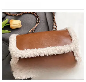 Close-up of caramel leather bag with plush white trim and woven chain strap details