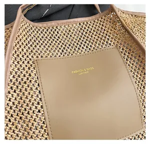 Detail of woven straw tote bag with premium leather patch pocket and gold lettering