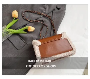 Detail of vintage brown leather bag with white plush trim and metal chain strap back
