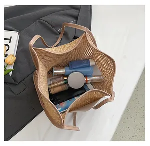 Detailed top view of large woven tote bag interior showing spacious capacity with makeup items