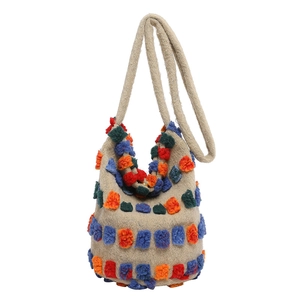 Handcrafted oatmeal woven tote bag with colorful contrast patches in bucket style
