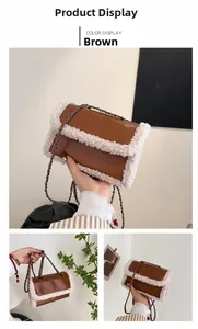 Detail of vintage brown leather bag with white fuzzy trim and metal chain strap