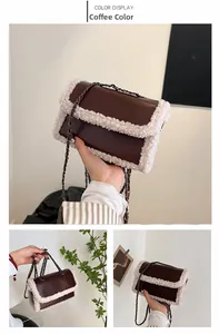 Detail view of coffee leather crossbody bag with white faux fur trim and chain strap