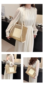 Macro detail of hand-woven straw tote bag with premium white leather trim and logo