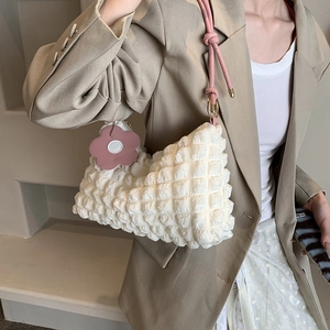 Chic popcorn texture white shoulder bag with pink rope straps and flower charm detail