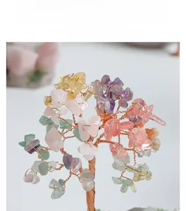 Detailed close-up of handmade multi-color crystal money tree with copper wire branches