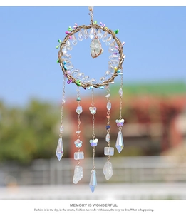 Detailed macro shot of bohemian crystal dreamcatcher featuring stones and faceted prisms