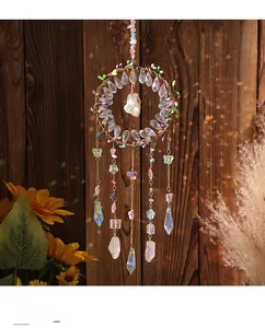 Detailed view of handmade Tree of Life dream catcher with crystals and colorful butterflies