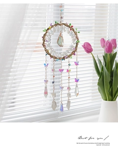 Detailed shot of handmade Tree of Life dream catcher with crystals and metal chains