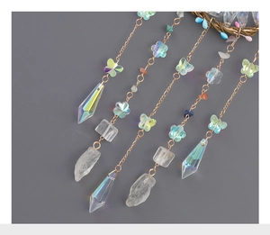 Detail of life tree dream catcher with colorful crystal beads and butterfly charms