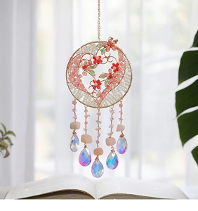 Detail of Tree of Life suncatcher with pink crystals and AB coated teardrop pendants