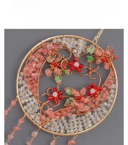 Detailed wire-wrapped Tree of Life pendant with pink and green crystal stones