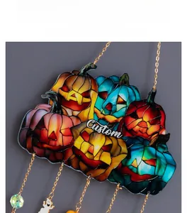 Detailed view of Halloween pumpkin wall hanging with custom text and ghost charms