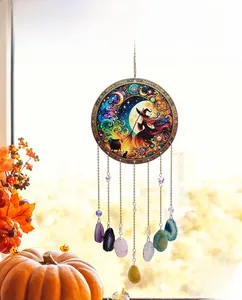 Detailed view of Tree of Life wind chime featuring agate slices and witch moon artwork