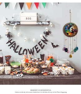 Detail of Halloween dreamcatcher with agate stones and witch design in festive party setting