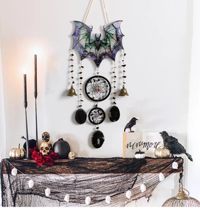 Gothic bat wind chime with skulls, dreamcatcher ring, and bells for Halloween decor