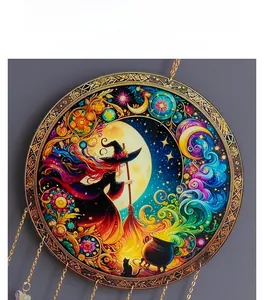 Detail of Halloween dreamcatcher with witch, black cat, and colorful crescent moon motifs