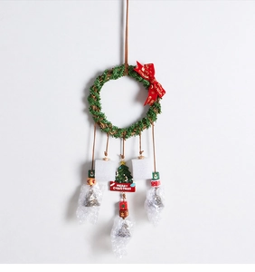 Green Christmas wreath decoration with Merry Christmas ribbon and wooden beads