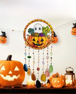 Macro view of Halloween wind chime featuring pumpkin patterns and colorful agate slices