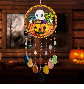 Close-up of Halloween wind chime with pumpkin illustration and natural agate slices