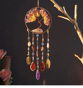 Detailed craftsmanship of Tree of Life crystal wind chime with hanging natural gemstones