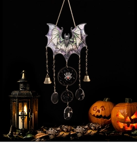 Detail of gothic bat suncatcher with stained glass wings, metal bells and spider charm