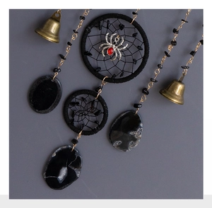Detailed Gothic dreamcatcher with black agate slices and vintage brass bell decor