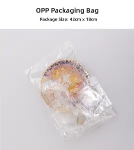 Detail of tree of life wind chime with colorful crystal stones in 42x18cm packaging