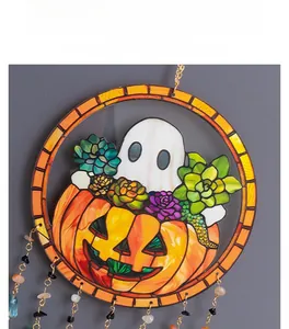 Detail of Halloween pumpkin ghost ornament featuring rainbow glass texture and gemstone chain
