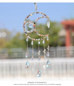 Detail of moon-shaped sun catcher with colorful crystals and white quartz pendant