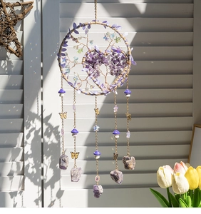 Detailed view of Tree of Life dreamcatcher with amethyst stones and golden butterfly charms