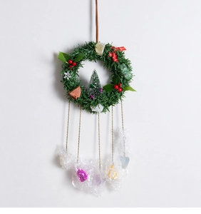 Detail of Christmas wreath with mini tree, natural stones and heart crystal pendants