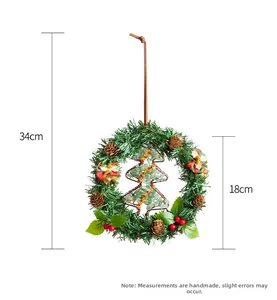 Detailed view of a 34cm Christmas wreath with pine needles and beaded tree ornament