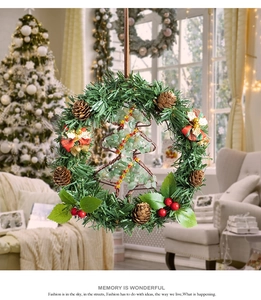 Detail of Christmas wreath featuring crystal stone tree, pine cones, and red berries