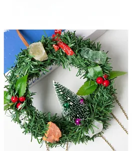 Close-up of Christmas wreath with natural raw crystals and frosted tree ornament